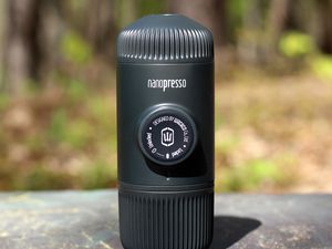 Wacaco Nanopresso displayed on a dark surface outside