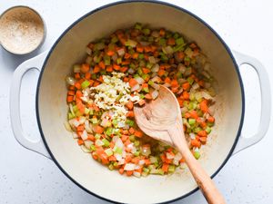 add garlic to the vegetables in the pan 