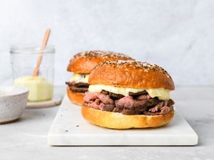 Two Beef on Wecks resting on a marble platter