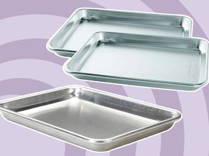 Three quarter sheet pans on a purple background