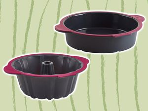 Two silicone baking pans on a green background