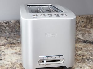 Closeup of Breville Diecast Smart Toaster displayed on marble countertop