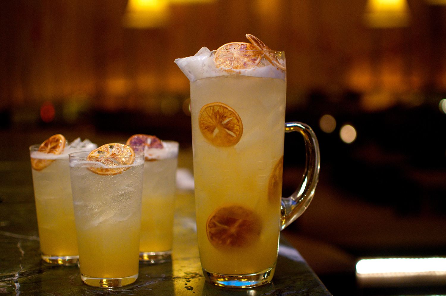 Glasses and a pitcher filled with centennial punch