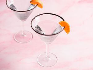 Chocolate and Orange Martini in martini glasses, garnished with orange slices 