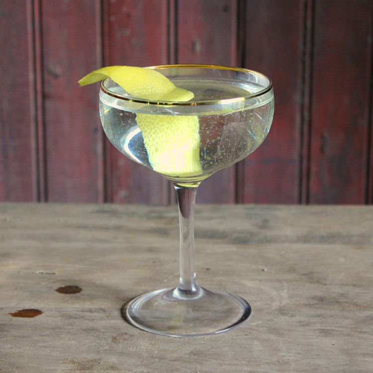 Classic Gin Martini in a glass with lemon twist