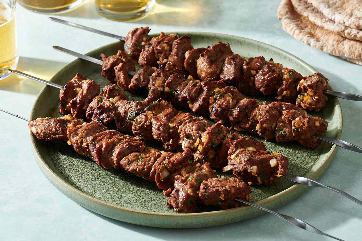 Classic Moroccan Lamb or Beef Kebabs (Brochettes) on a platter 