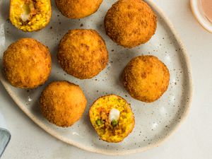 Classic Sicilian arancini rice balls on a serving dish