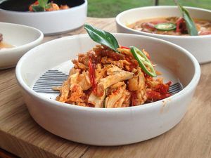 Shredded chicken In bowl on table