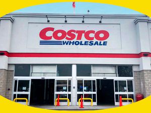 A photo of a Costco storefront showing the sliding doors open