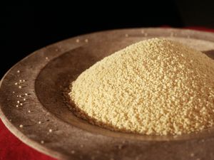 plain couscous in wooden bowl