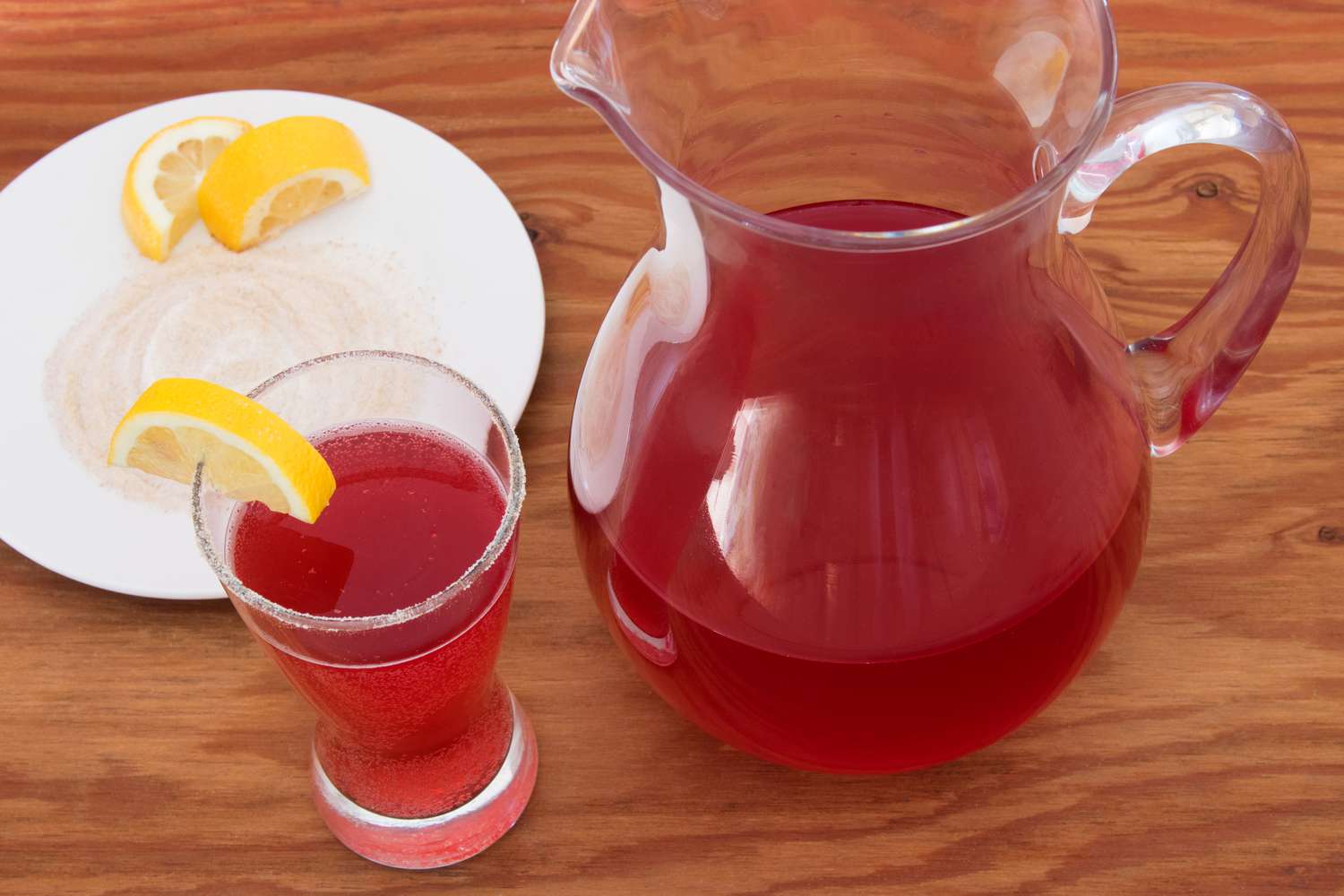 Cranberry Ginger Shandy in a glass with a ginger sugar rim