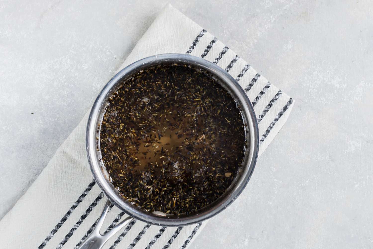 Lavender simple syrup simmering in a saucepan