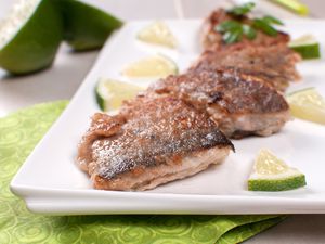 Fried white fish pieces with lime