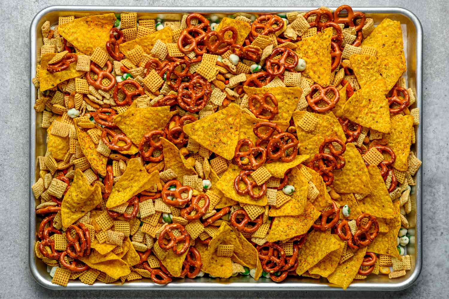 furikake chex mix ingredients mixed together on one sheet pan