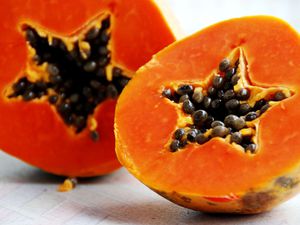 Half cut fresh papaya with star shape heart with seeds