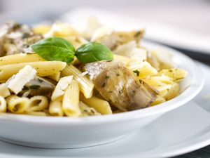 Penne with artichokes in a bowl