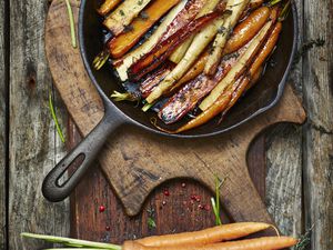 Honey roasted carrots and parsnips in a pan