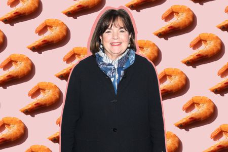 A photo of Ina Garten in front of a light pink background with shrimp evenly spaced on it