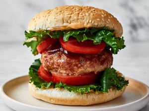 Juicy baked turkey burgers with garlic on a plate