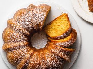 Kentucky butter bundt cake sliced and sprinkled with confectioners' sugar