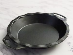 Lodge Cast Iron Pie Pan displayed on a marble counter