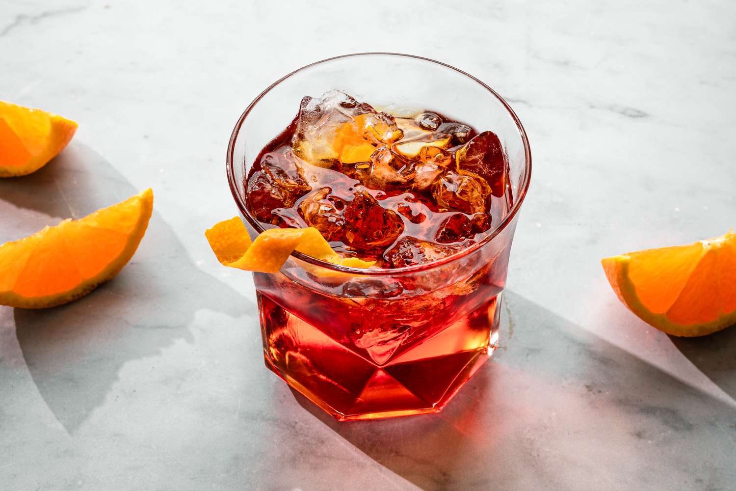 Negroni in a glass with a twist of orange