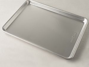 Nordic Ware Naturals Baker's Half Sheet displayed on a grey surface