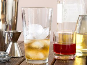 Pouring Whiskey in a Mixing Glass for Cocktails