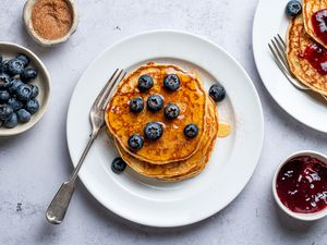 Passover Pancakes garnished with syrup and blueberries on a plate