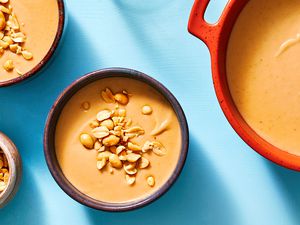 Southern Peanut Soup in a pot and in bowls 