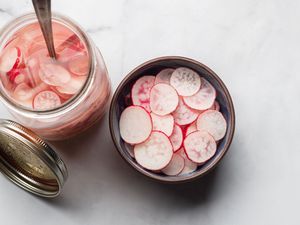 Fermented Radish Pickle in a jar and a bowl 