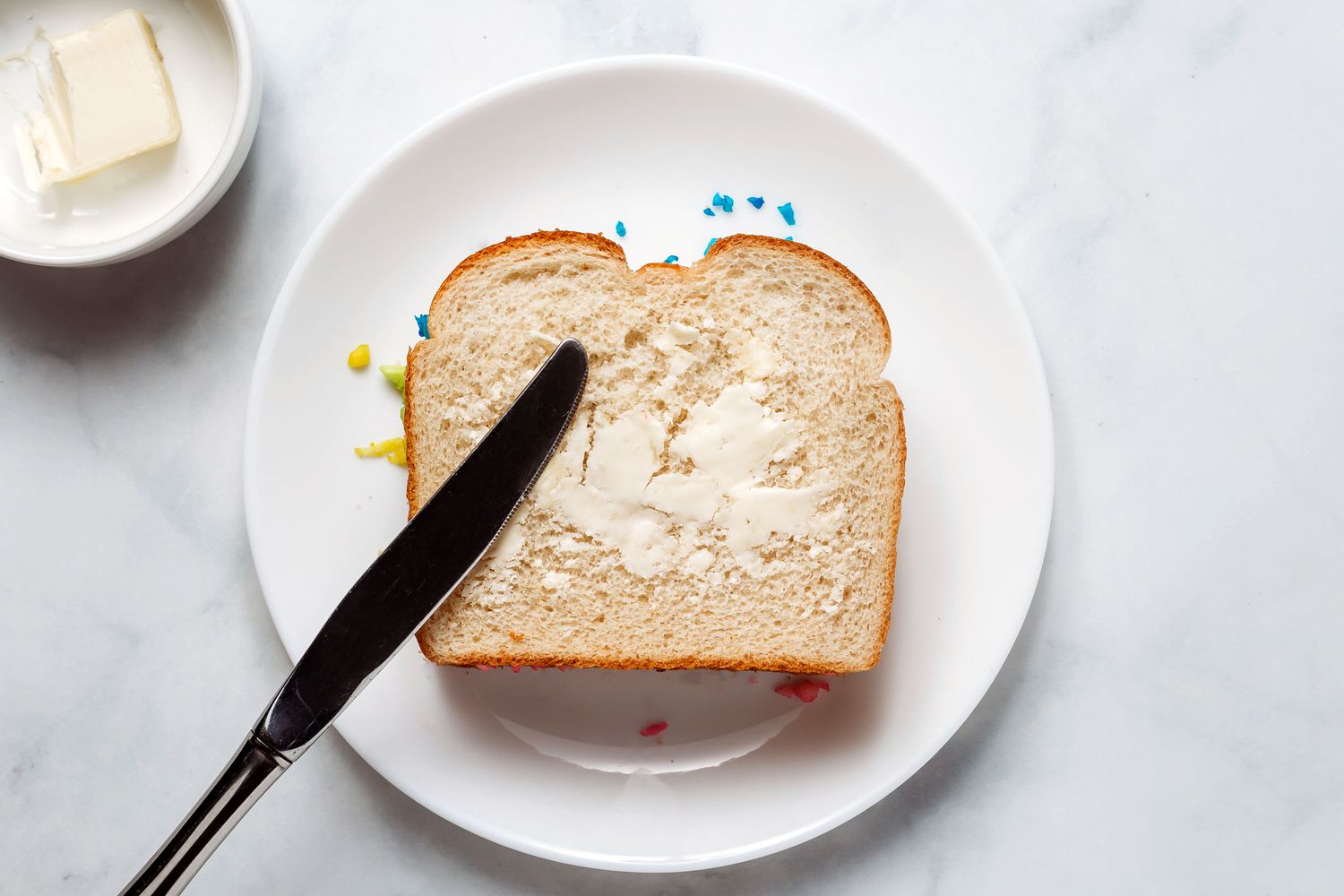 second piece of bread placed on top with butter on bread