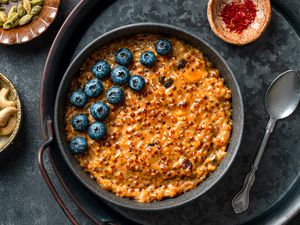 sabudana payesh in bowl with blueberries on top