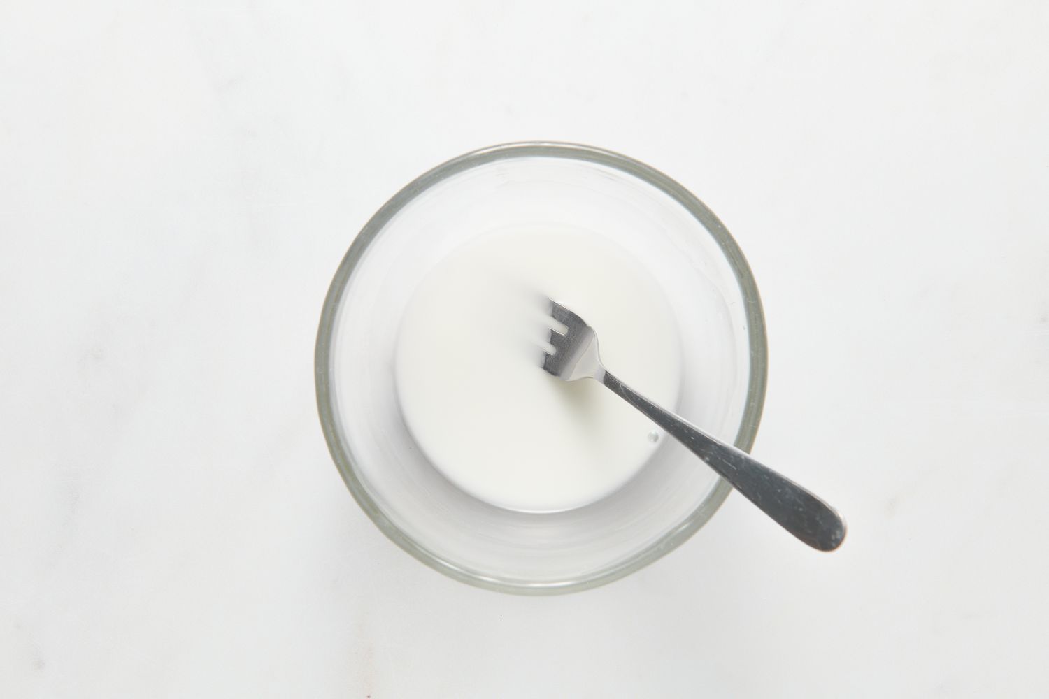 A small glass bowl of cornstarch and water