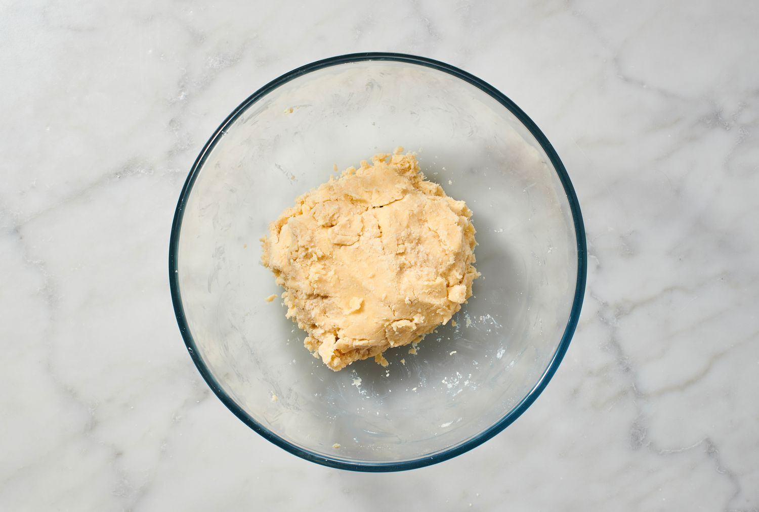 A bowl with a round piece of pie dough