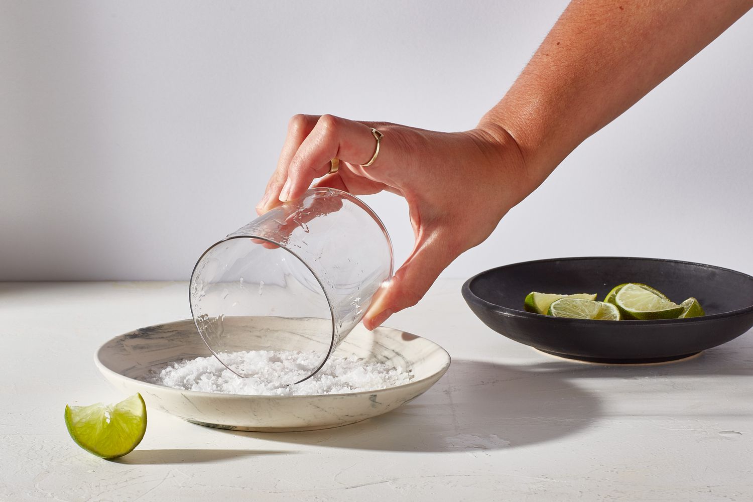 glass being rimmed in salt on plate