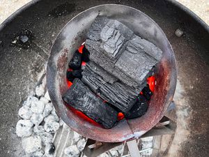 Masterbuilt lump charcoal burning in a grill