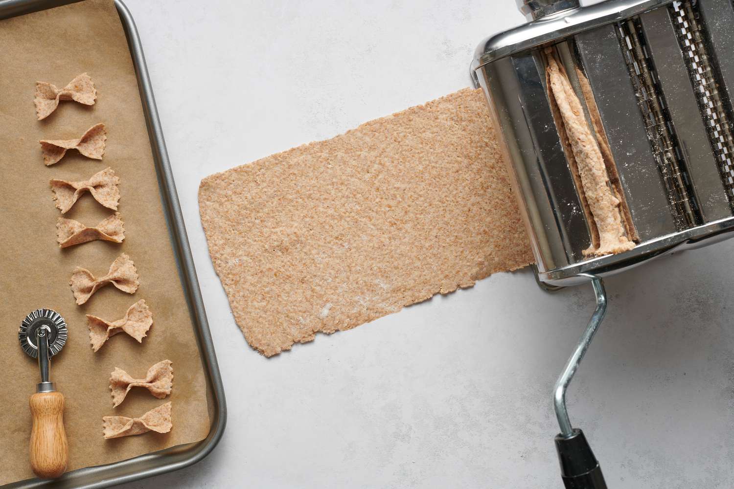 Pasta chip dough running through a pasta extruder