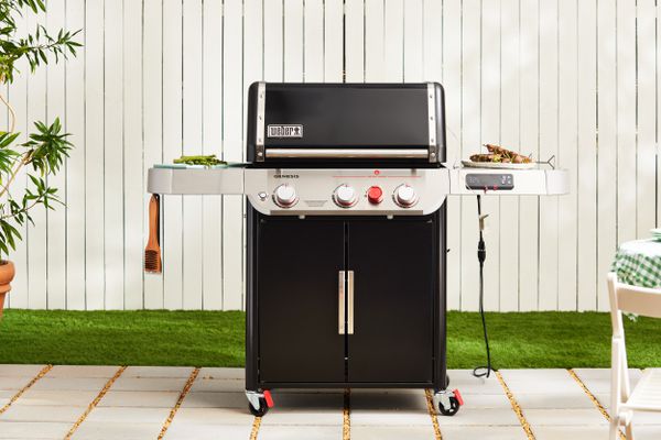 Weber Genesis EX-325S Propane Gas Smart Grill displayed on a patio