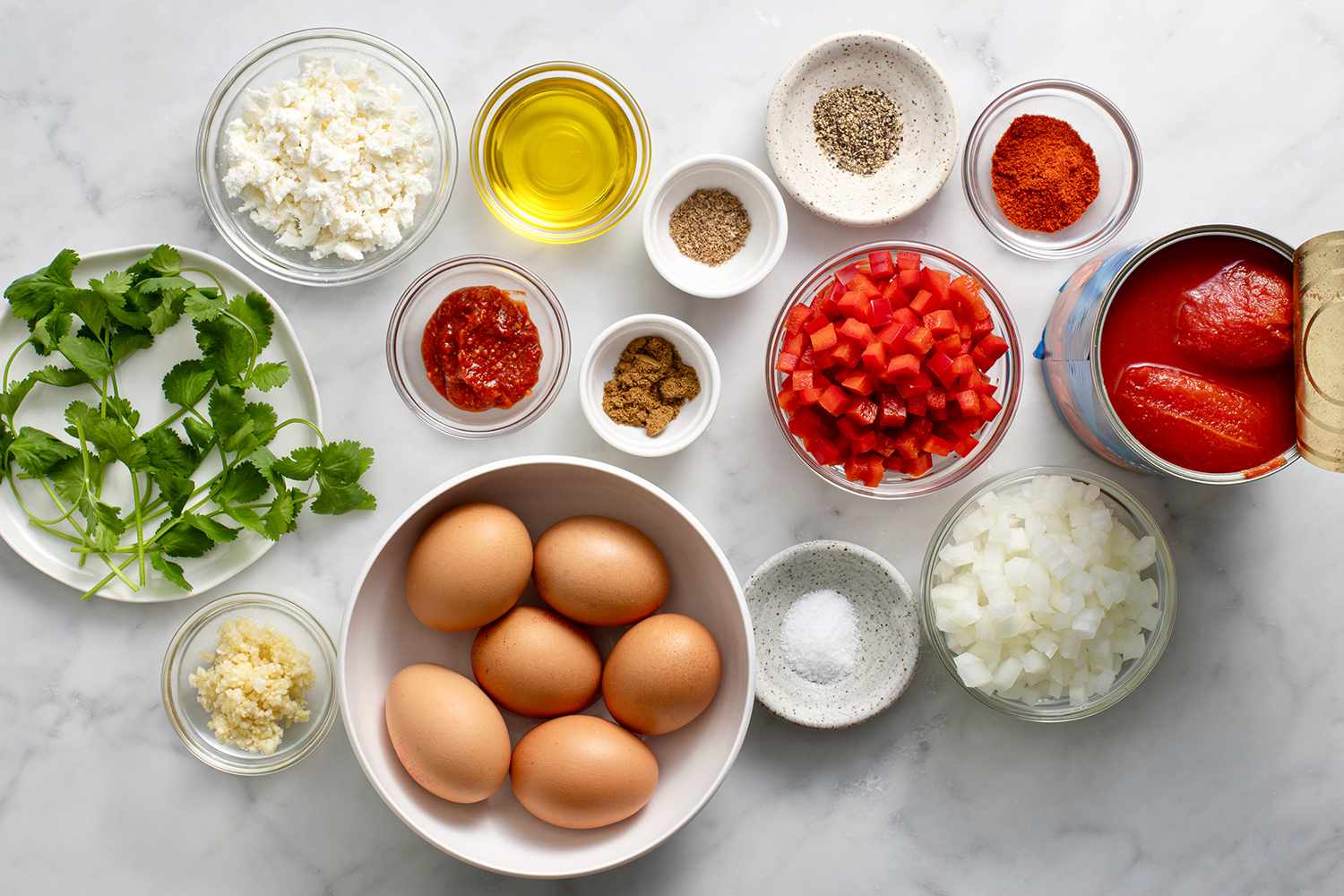 Shakshuka ingredients in bowls 