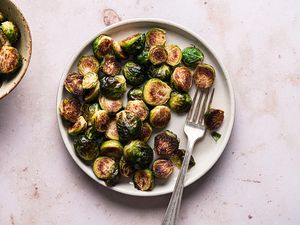 Roasted Brussels Sprouts on a plate with a fork 