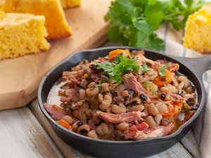 Southern crock pot black-eyed peas in a cast-iron skillet