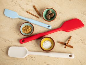 Oxo Good Grips Silicone Spatula Set displayed between three bowls of ingredients