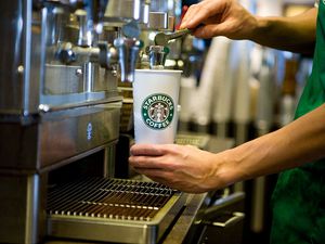 Barista pouring coffee