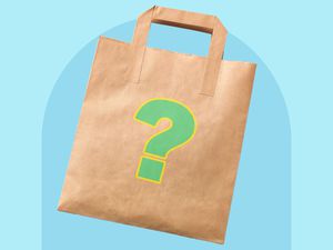 A brown paper bag with a question mark on it