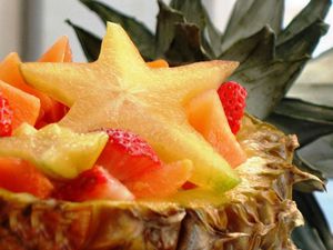 Tropical fruit salad served in a pineapple