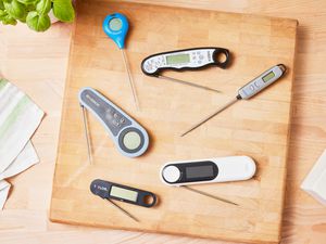 Best instant read thermometers arranged on a wood cutting board