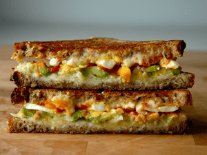 Avocado and Soft-Boiled Egg grilled Cheese with Sriracha